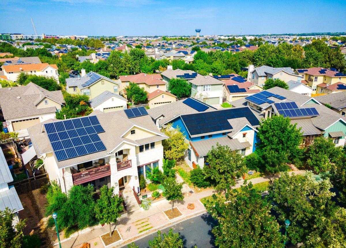 Aerial drone view of the Mueller District in Austin, Texas, USA - endless solar panels and a renewable, sustainable community of homes
