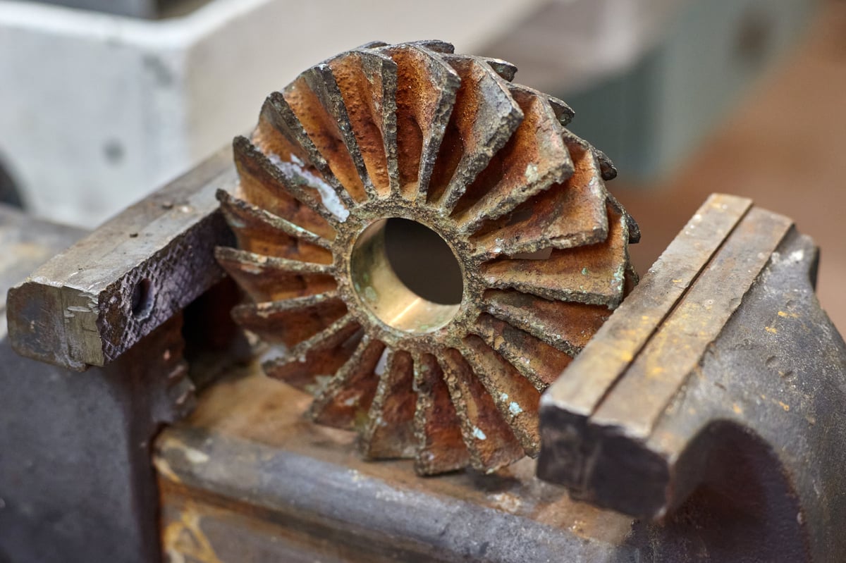 Close up of worn out bronze impeller from centrifugal pump